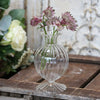 Set of three pretty clear glass bud vases